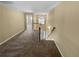 Spacious carpeted hallway, featuring natural light, access to stairs, and connecting rooms at 2470 Arnold Mill Rd, Lawrenceville, GA 30044