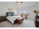 Comfortable bedroom with large bed, soft carpet, and natural light from the windows at 3908 Charleston Market St, Suwanee, GA 30024