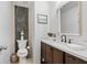 Stylish half bathroom with elegant marble accents and modern vanity at 3908 Charleston Market St, Suwanee, GA 30024