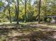 Lush and secluded backyard with mature trees and manicured lawn at 724 Se Cowan Se Rd, Conyers, GA 30094