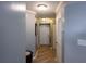 Hallway featuring wood floors, storage closet, and neutral paint at 795 Hammond Dr # 1812, Atlanta, GA 30328