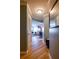 Bright hallway featuring hardwood floors that lead to the living area and kitchen at 795 Hammond Dr # 1812, Atlanta, GA 30328