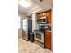 Kitchen area with stainless steel appliances, tile floors, and cherry cabinets at 795 Hammond Dr # 1812, Atlanta, GA 30328