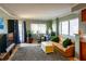 A shot of the living room, showing the sofa, windows, desk, and rug at 795 Hammond Dr # 1812, Atlanta, GA 30328