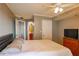 The main bedroom is shown, with a large bed, tv, and attached bathroom at 795 Hammond Dr # 1812, Atlanta, GA 30328