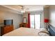 The main bedroom is shown, featuring a large bed, TV, dresser, and natural light at 795 Hammond Dr # 1812, Atlanta, GA 30328