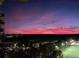 Stunning night view from the balcony, capturing the city lights and illuminated sports field at 795 Hammond Dr # 1812, Atlanta, GA 30328