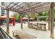 Outdoor kitchen area with built-in grill and covered seating for al fresco dining at 795 Hammond Dr # 1812, Atlanta, GA 30328