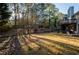 Expansive backyard with mature trees, multi-level deck, and fenced perimeter, great for outdoor entertaining and recreation at 1971 Commonwealth Way, Grayson, GA 30017