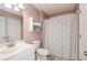 Bathroom featuring a white vanity and bathtub with a shower at 1971 Commonwealth Way, Grayson, GA 30017