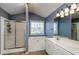 Spacious main bathroom with separate shower and tub, double sink vanity, and a neutral color scheme at 1971 Commonwealth Way, Grayson, GA 30017