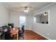 Neutral-colored office with hardwood floors, a desk, and a window provides a comfortable workspace at 1971 Commonwealth Way, Grayson, GA 30017