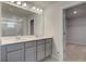 Bathroom featuring double sinks, large mirror and walk in shower at 246 Arnewood Cir, Mcdonough, GA 30253