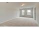 Spacious carpeted bedroom with neutral walls and natural light at 246 Arnewood Cir, Mcdonough, GA 30253