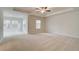 Large bedroom featuring a ceiling fan, trey ceiling, and natural light at 246 Arnewood Cir, Mcdonough, GA 30253