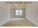 Elegant dining room with coffered ceiling, chandelier, and hardwood floors at 246 Arnewood Cir, Mcdonough, GA 30253