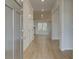 Inviting foyer with hardwood floors and neutral color palette at 246 Arnewood Cir, Mcdonough, GA 30253