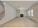 Bright living room with fireplace, staircase, and plenty of natural light from large windows at 246 Arnewood Cir, Mcdonough, GA 30253