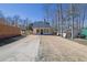 Exterior showing a compact house with a driveway and neat landscaping at 2550 Belaire Dr, Cumming, GA 30041