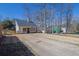 Exterior shot of a house featuring a cozy yard and driveway at 2550 Belaire Dr, Cumming, GA 30041