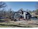 Expansive backyard view showcasing the deck, hot tub, mature trees and surrounding landscape at 4610 Riversound Drive, Snellville, GA 30039