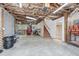 Unfinished basement with open ceiling and a stairway at 4610 Riversound Drive, Snellville, GA 30039