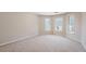 Spacious bedroom filled with light from three large windows at 4610 Riversound Drive, Snellville, GA 30039