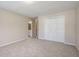 Large bedroom featuring neutral carpet, double closet, and an ensuite bath at 4610 Riversound Drive, Snellville, GA 30039