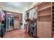 Walk-in closet with built-in shelving, drawers, and plenty of storage space for clothes and accessories at 4610 Riversound Drive, Snellville, GA 30039