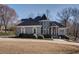 Charming home with stone accents, mature landscaping, and a circular driveway at 4610 Riversound Drive, Snellville, GA 30039