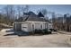 Angle view of the home displaying the attached garage, long driveway, and turret at 4610 Riversound Drive, Snellville, GA 30039