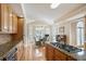 Kitchen with stainless steel appliances, granite counters, custom wood cabinetry, and breakfast nook at 4610 Riversound Drive, Snellville, GA 30039