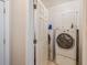 Laundry room featuring a modern washer and dryer and storage cabinets at 4610 Riversound Drive, Snellville, GA 30039