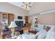 Bright living room with a fireplace, built-in shelving, and comfortable white sectional sofa at 4610 Riversound Drive, Snellville, GA 30039