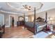 The bright main bedroom features hardwood floors, a tray ceiling, and plenty of space at 4610 Riversound Drive, Snellville, GA 30039