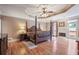 This main bedroom boasts hardwood floors, a tray ceiling, and a fireplace at 4610 Riversound Drive, Snellville, GA 30039