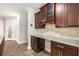 Kitchen featuring granite counters, custom cabinets, tile flooring, and tile backsplash at 1106 Sanders Se Ave, Atlanta, GA 30316