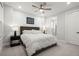 Bright bedroom features a plush bed, modern furnishings, and ensuite bathroom at 118 Village Green Ave, Woodstock, GA 30189