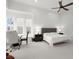 Bright primary bedroom with white plank walls and views from multiple windows at 118 Village Green Ave, Woodstock, GA 30189