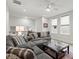 Upstairs living area features neutral color palettes, comfortable seating, and hardwood floors at 118 Village Green Ave, Woodstock, GA 30189
