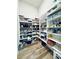 Walk-in pantry with custom built-in shelves and plenty of room for storage at 118 Village Green Ave, Woodstock, GA 30189