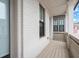 Exterior shot showcasing white brick porch, dark framed windows at 118 Village Green Ave, Woodstock, GA 30189
