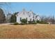 Beautiful two story home with manicured front lawn and shrubbery at 1625 Watercrest Dr, Cumming, GA 30041