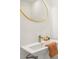 Bathroom featuring modern fixtures, a gold framed mirror, and sink at 169 Wadley Nw St, Atlanta, GA 30314