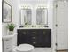 Bathroom features a double vanity with gold hardware, modern mirrors, and stylish fixtures at 169 Wadley Nw St, Atlanta, GA 30314