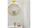 Stylish bathroom featuring a round mirror, modern faucet, and elegant decor at 169 Wadley Nw St, Atlanta, GA 30314