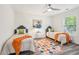 Bedroom featuring two beds, a colorful rug, and large window at 169 Wadley Nw St, Atlanta, GA 30314