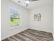 Bedroom with hardwood floors, modern fan, and natural light from the window at 169 Wadley Nw St, Atlanta, GA 30314