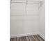 Empty closet featuring new shelving and wood-look flooring at 169 Wadley Nw St, Atlanta, GA 30314