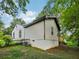 Cozy home exterior with a mix of siding and concrete foundation, set amid lush greenery at 169 Wadley Nw St, Atlanta, GA 30314
